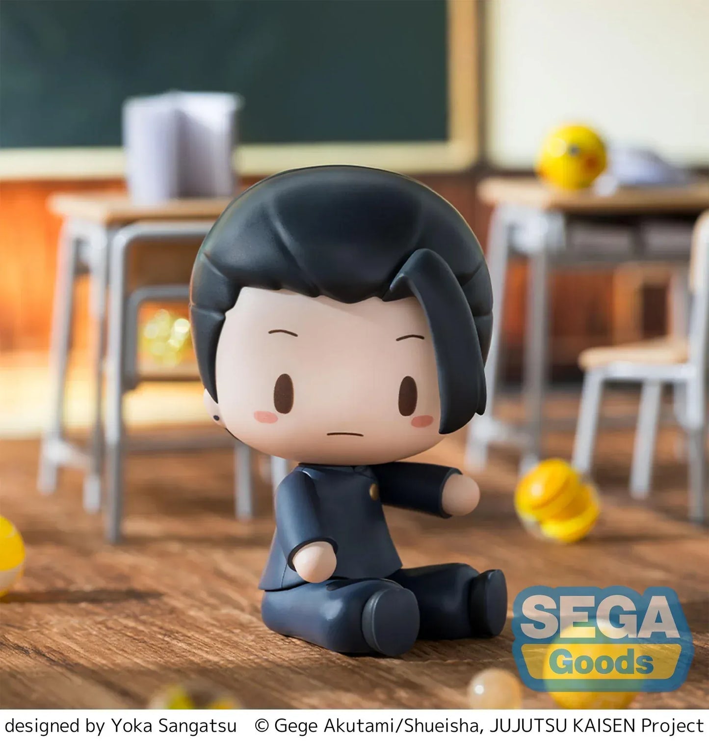 Chibi Suguru Geto Fuwa Petit figure sitting on a wooden floor in a classroom scene from Jujutsu Kaisen.