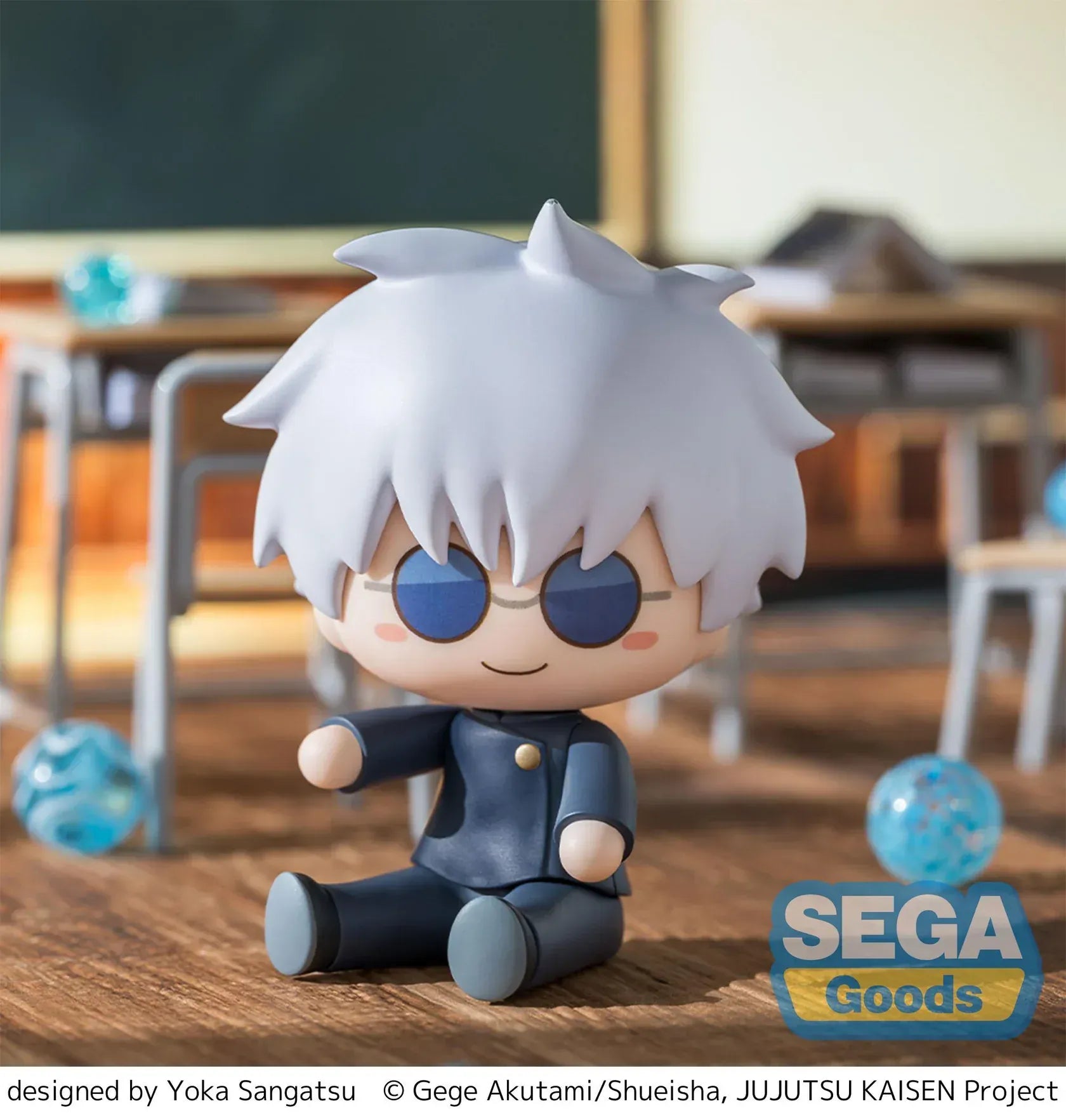 Chibi Satoru Gojo Fuwa Petit figure sitting on the floor with blue glasses and fluffy white hair from Jujutsu Kaisen.