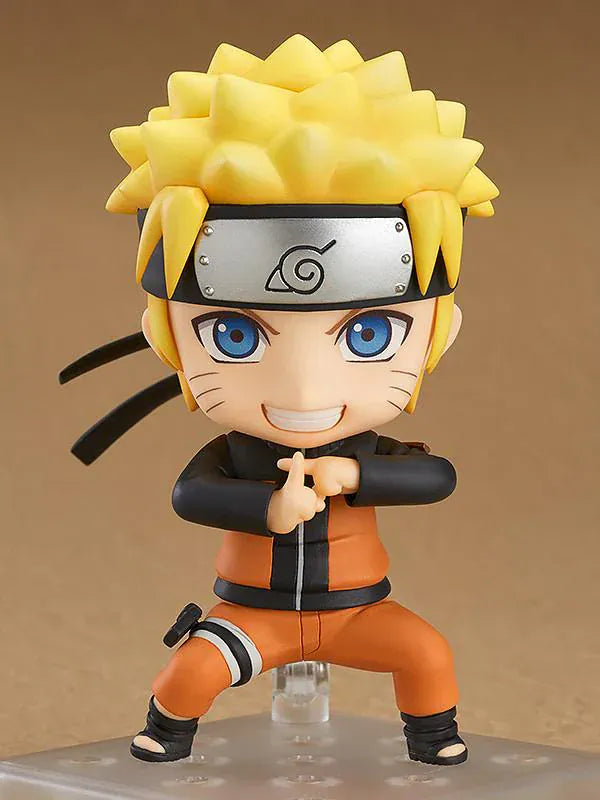 Chibi Nendoroid Naruto Uzumaki in orange jumpsuit performing the Shadow Clone Jutsu pose.