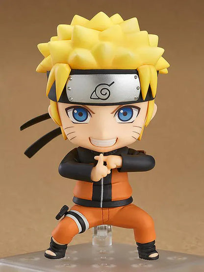 Chibi Nendoroid Naruto Uzumaki in orange jumpsuit performing the Shadow Clone Jutsu pose.