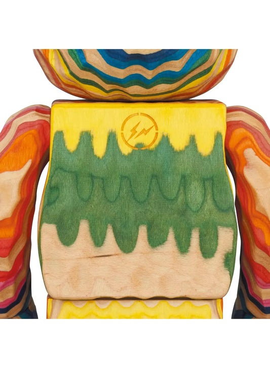 BE@RBRICK Karimoku fragmentdesign HAROSHI VERTICAL 400% wooden figure with multicolored contour patterns, blue arms, green legs, and natural wood tones.