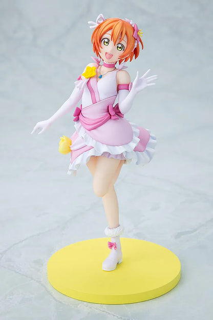 Love Live School Idol Project KD Colle Rin Hoshizora Bokutachi wa Hitotsu no Hikari Ver. Figure featuring Rin in a pink and white idol outfit with yellow flower accents, white gloves, and yellow display base.