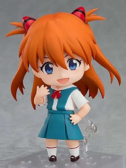 Rebuild of Evangelion Nendoroid Asuka Shikinami Langley Figure Rerelease featuring Asuka with orange twin tails, blue eyes, school uniform, and cheerful waving pose.