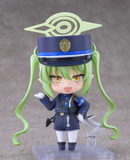 Blue Archive Nendoroid Nozomi Tachibana Figure featuring Nozomi with light green twin tails, golden eyes, oversized officer cap, academy uniform, and halo-style effect piece.