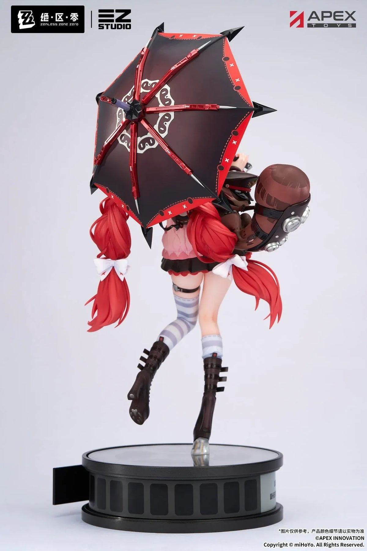 Zenless Zone Zero Yuzuha Ukinami 1/7 Scale Figure by APEX Toys featuring a red-haired anime girl with long braided twin-tails, green eyes, a pink jacket, layered red skirt, striped thigh-high stockings, and black boots while holding a large red umbrella on a circular display base.