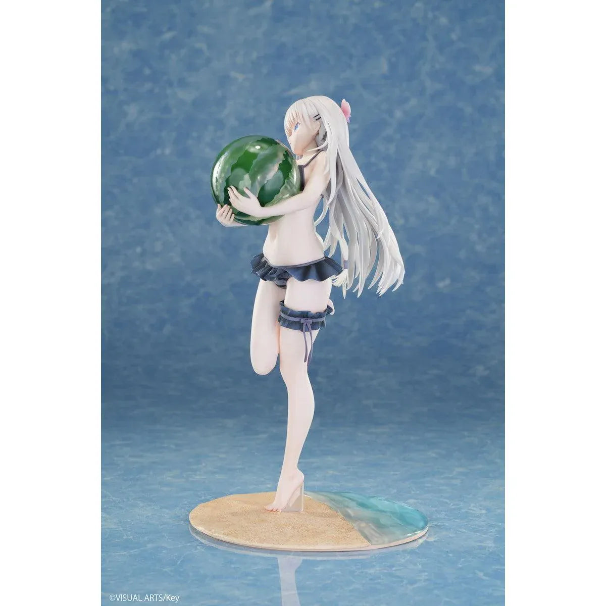 Summer Pockets REFLECTION BLUE Shiroha Naruse 1/6 scale figure wearing a black swimsuit and holding a watermelon on a beach-themed base.