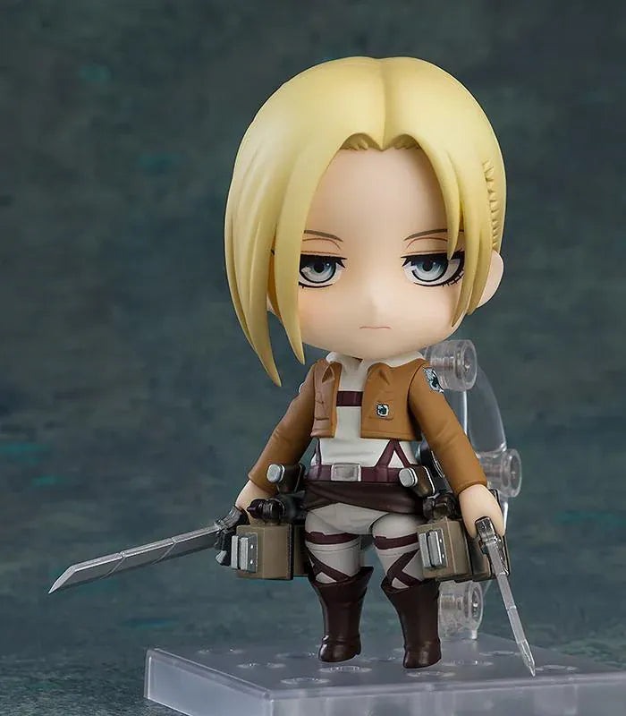 Attack on Titan Nendoroid Annie Leonhart rerelease figure with blonde hair, military uniform, dual blades, and vertical maneuvering equipment.