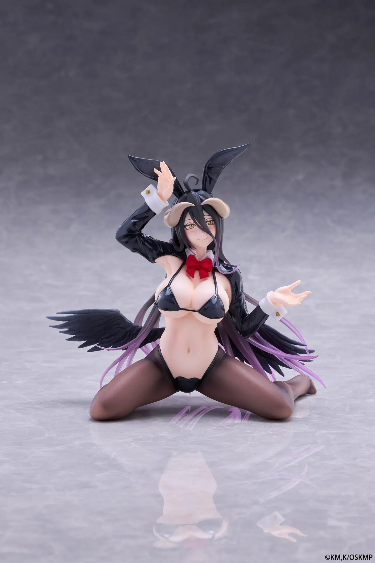 Albedo MOFLOCK Reverse Bunny Suit figure wearing a glossy black outfit with bunny ears, sheer stockings, horns, and black wings.