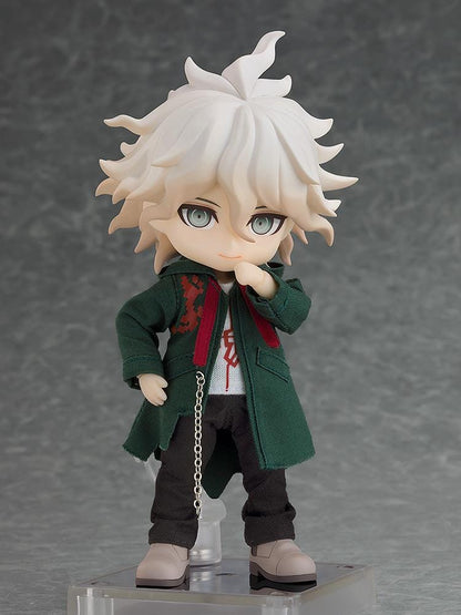 Danganronpa 2x2 Nendoroid Doll Nagito Komaeda with white hair, a dark green fabric coat, black trousers, gray shoes, and a silver-colored chain.
