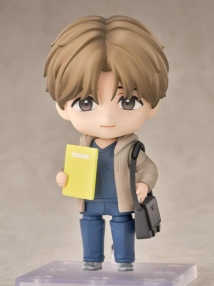 Jinx Nendoroid Kim Dan Figure featuring Kim Dan in a chibi style with brown hair, a casual outfit, yellow notebook, and black shoulder bag.