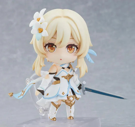 Genshin Impact Nendoroid Traveler Figure Lumine Rerelease featuring Lumine with blonde hair, golden eyes, white-and-blue fantasy outfit, flower hair accessory, and sword accessory.