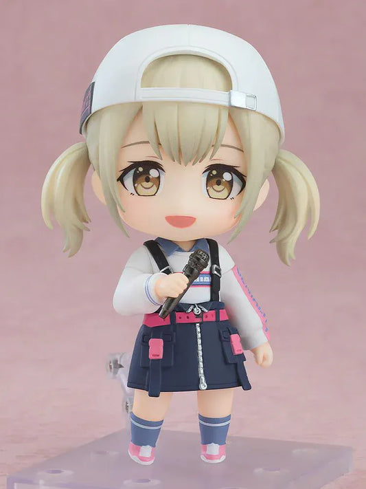 Chibi-style Nendoroid figure of Azusawa Kohane from Project Sekai wearing a backwards white cap and street-style outfit, holding a microphone and smiling.