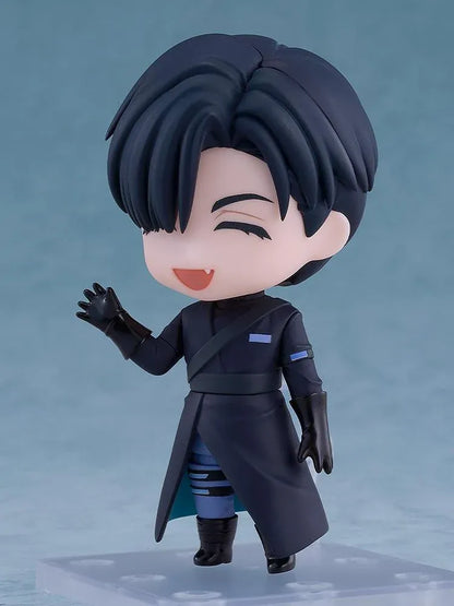 ALIEN STAGE Nendoroid Ivan Figure featuring a black-haired anime character with dark eyes, a small fang, a dark long-sleeved outfit, black gloves, and matching boots while holding a light-blue accessory.