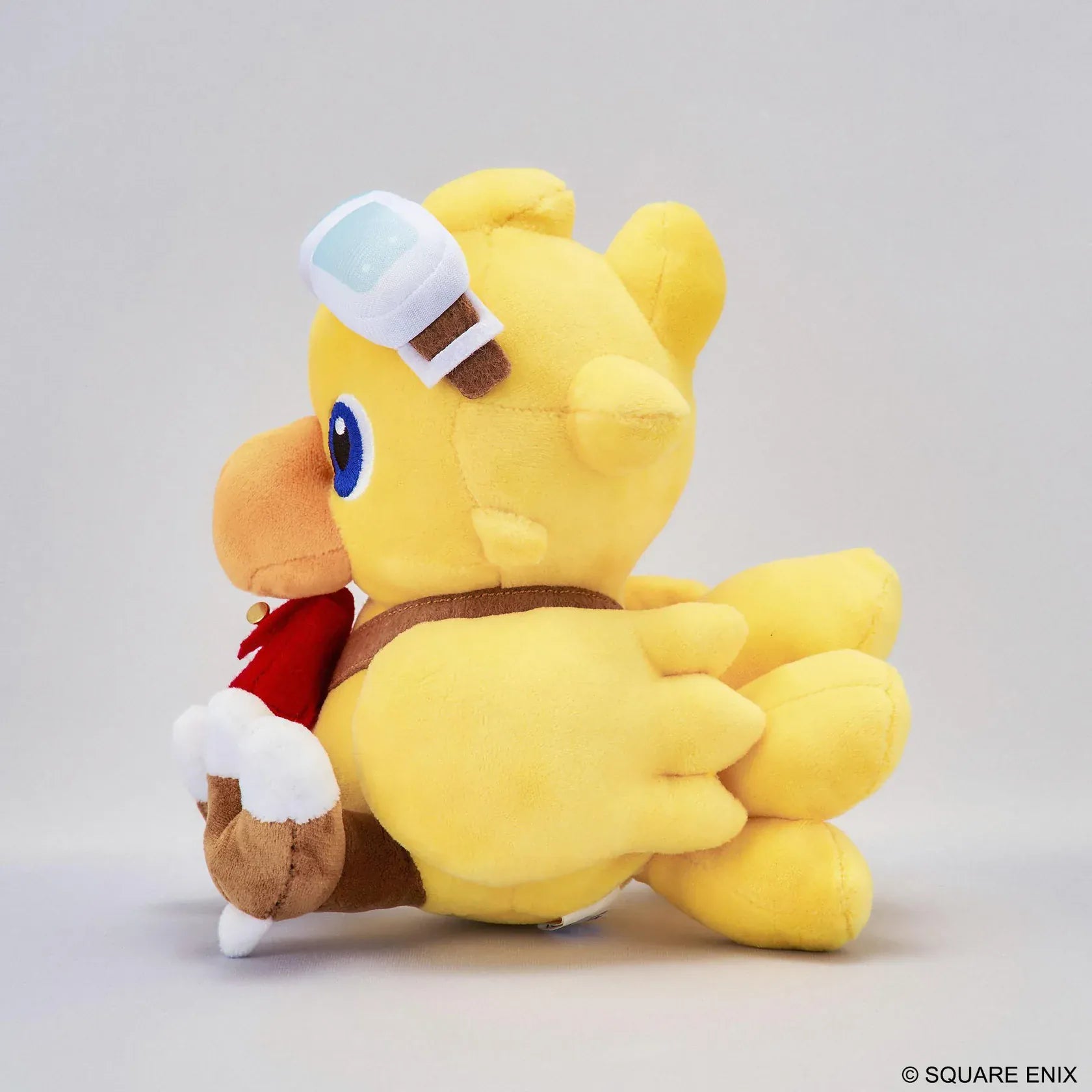 Final Fantasy Chocobo Chocobo and the Airship Ver. Plush with yellow Chocobo, pilot goggles, travel bag, blue embroidered eyes, and seated plush design