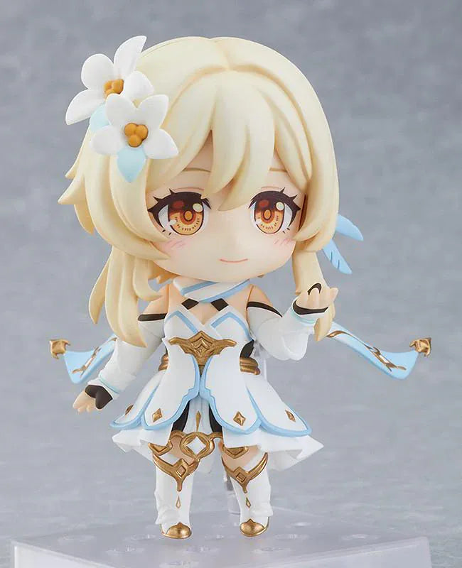 Genshin Impact Nendoroid Traveler Figure Lumine Rerelease featuring Lumine with blonde hair, golden eyes, white-and-blue fantasy outfit, flower hair accessory, and sword accessory.