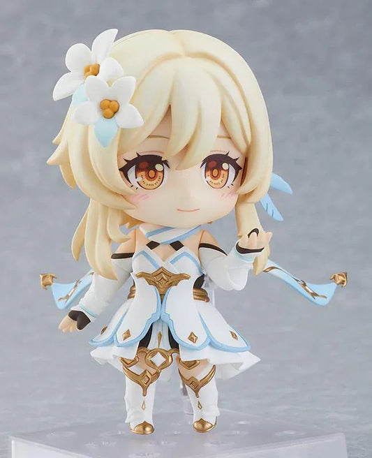Genshin Impact Nendoroid Traveler Figure Lumine Rerelease featuring Lumine with blonde hair, golden eyes, white-and-blue fantasy outfit, flower hair accessory, and sword accessory.