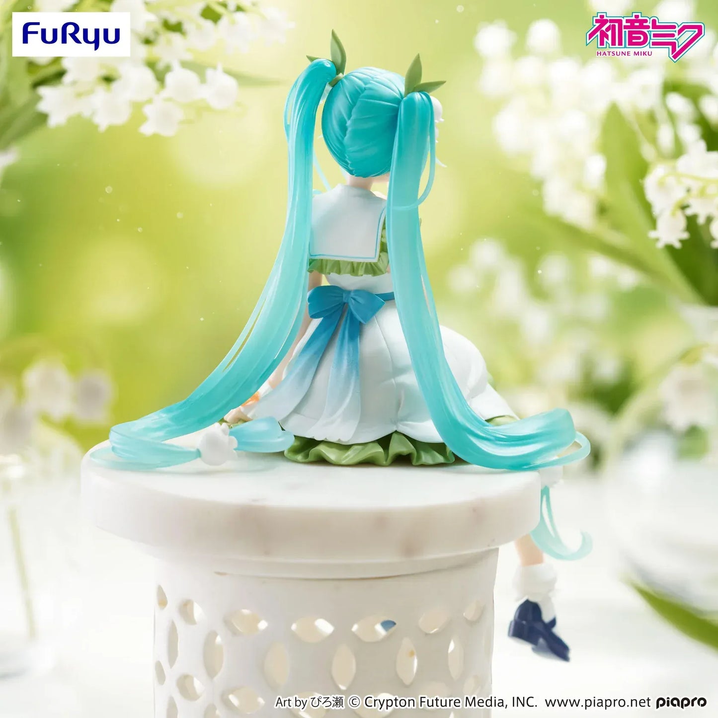Seated Hatsune Miku Flower Fairy Lily of the Valley noodle stopper figure in a white and green dress with long twin-tails and lily-of-the-valley hair accessories.
