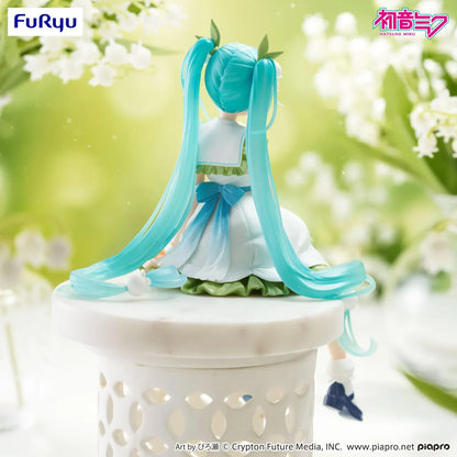 Seated Hatsune Miku Flower Fairy Lily of the Valley noodle stopper figure in a white and green dress with long twin-tails and lily-of-the-valley hair accessories.