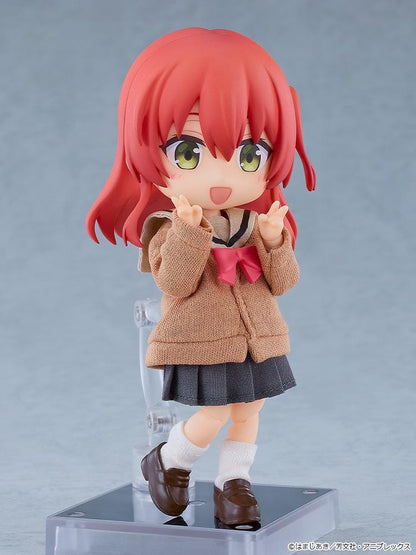Bocchi the Rock Nendoroid Doll Ikuyo Kita featuring Kita with red hair, green eyes, a fabric cardigan outfit, skirt, socks, and loafers.
