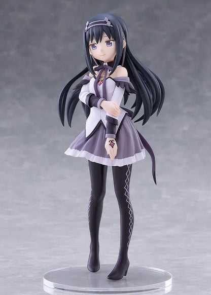 Homura Akemi figure with long black hair, violet eyes, a white and purple outfit, and diamond-patterned stockings, smiling with one hand resting on her arm.