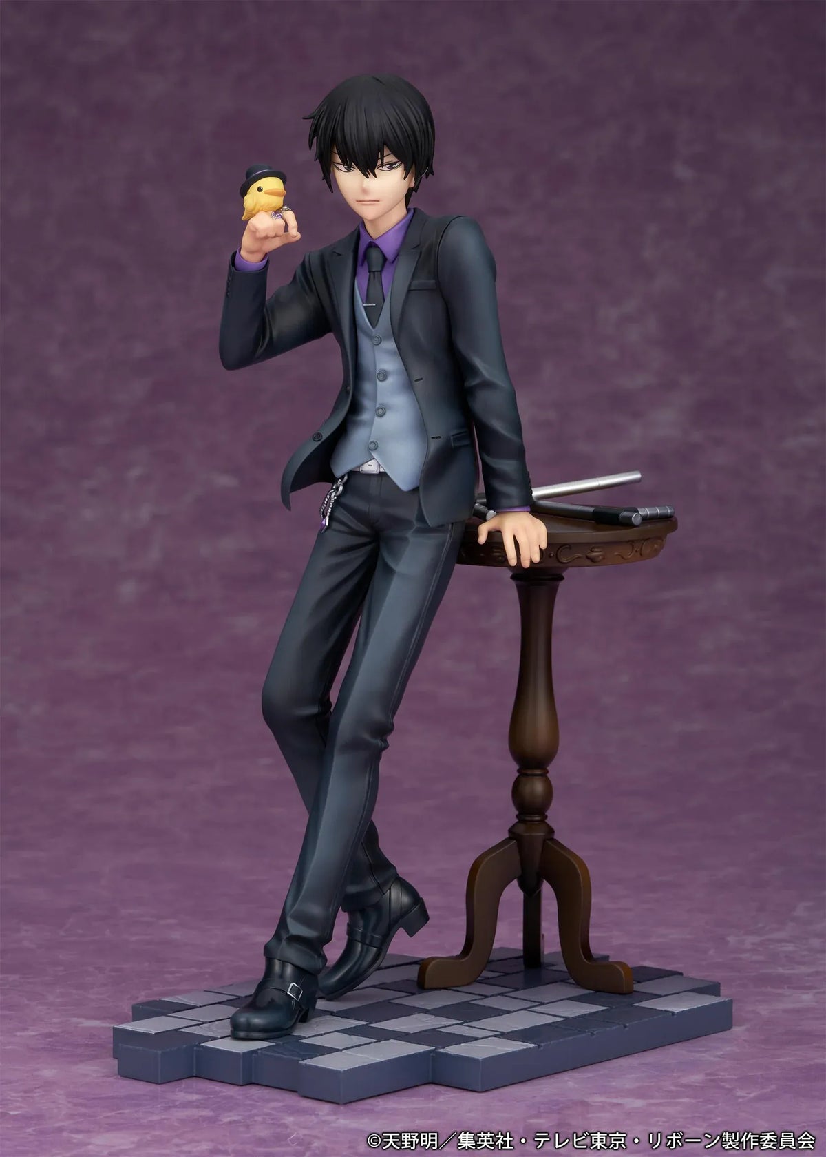 REBORN! Kyoya Hibari Scale Figure featuring a black-haired anime character wearing a black suit, purple shirt, gray vest, and tie, leaning against a wooden table with tonfa weapons while holding his yellow bird companion Hibird.