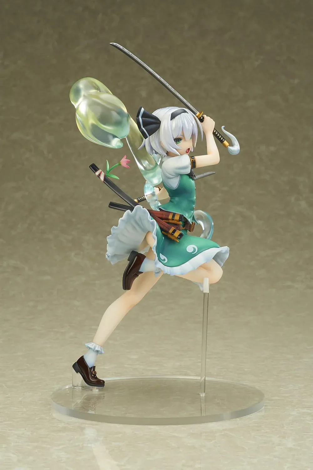 Touhou Project Youmu Konpaku figure wielding two swords in an airborne pose, wearing a green outfit with a translucent swirling spirit effect.