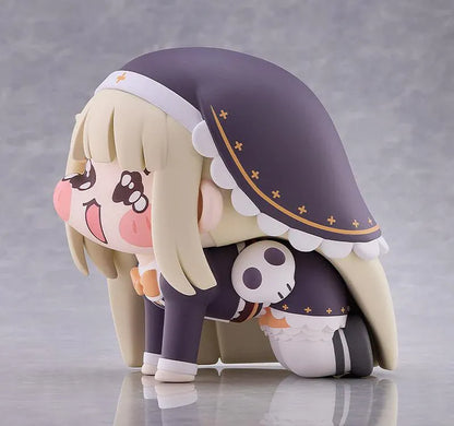 Petite Speaki soft vinyl figure with blonde hair, rosy cheeks, sparkling eyes, and a dark hood with gold accents.