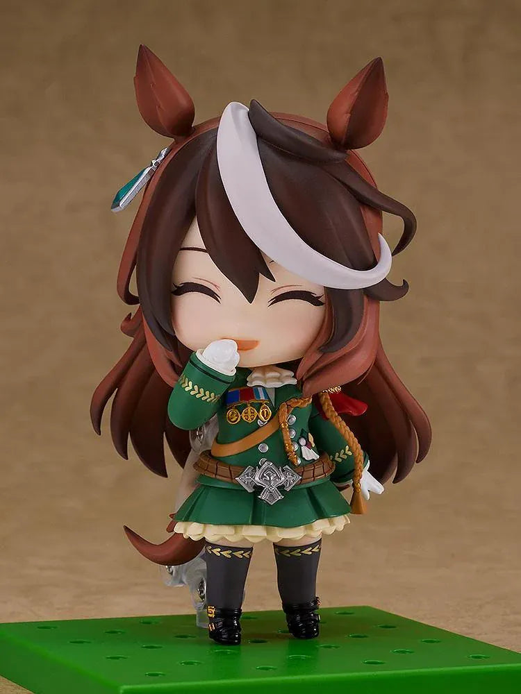 Umamusume Pretty Derby Nendoroid Symboli Rudolf Figure (Rerelease) featuring a brown-haired horse girl with a white forelock, purple eyes, green academy uniform, gold decorations, red cape, and black boots.