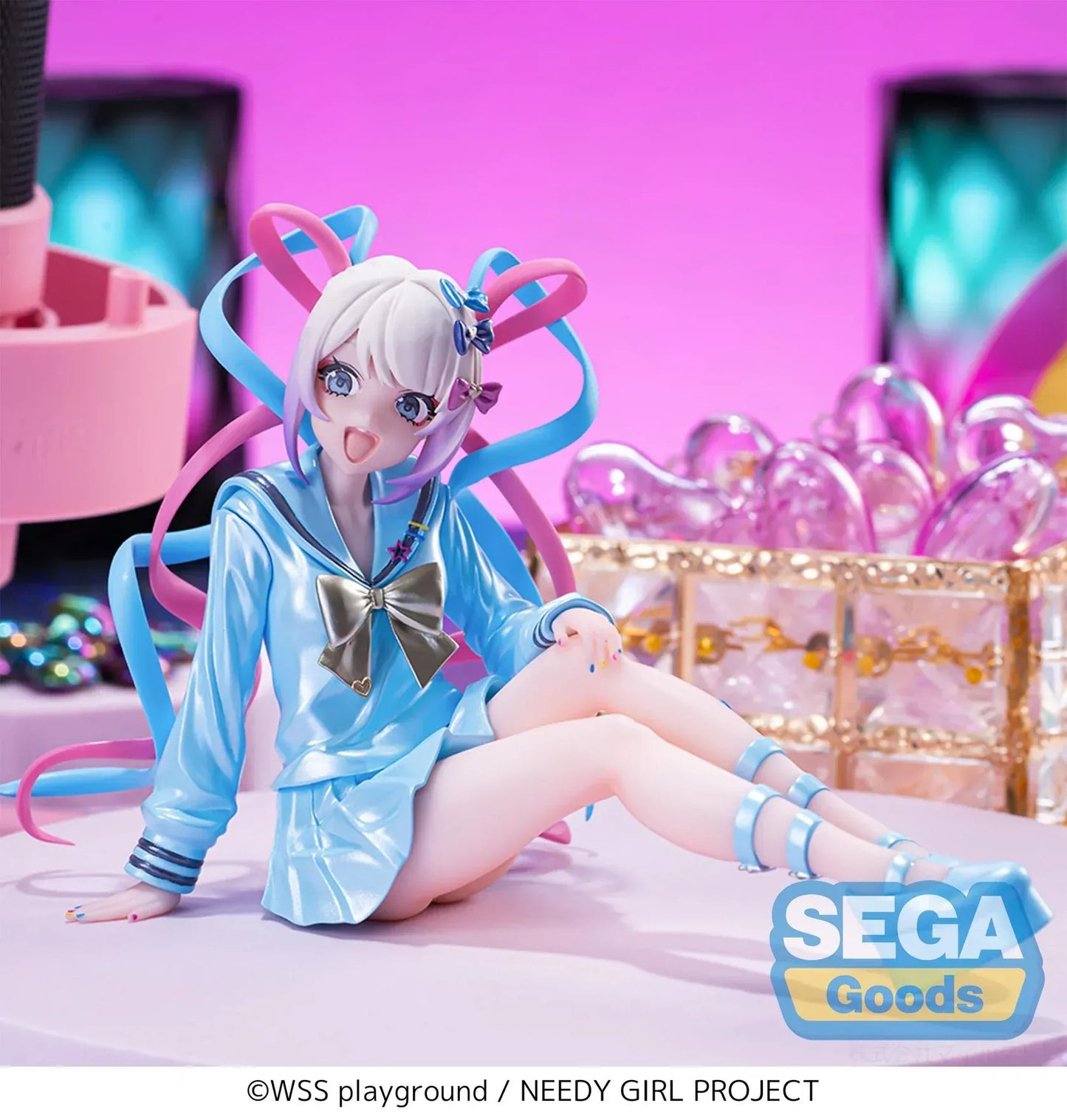 Figure of OMGKawaiiAngel sitting in a perching pose with pastel ribbons, glossy outfit, and energetic expression.