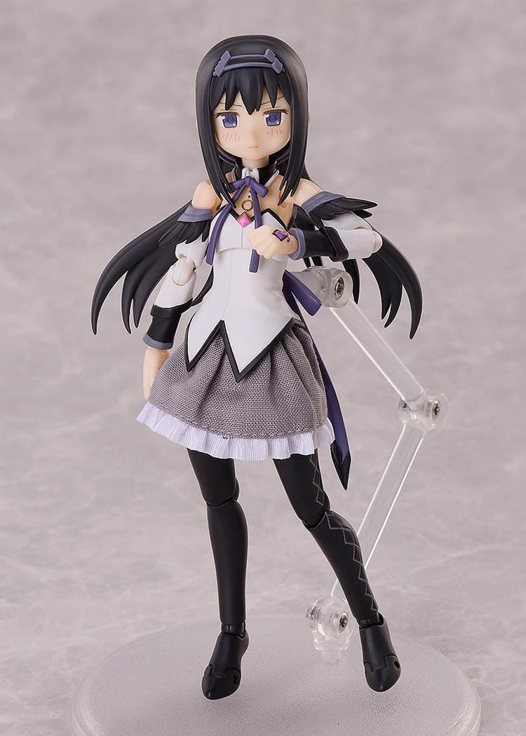 Puella Magi Madoka Magica The Movie Walpurgisnacht Rising BUZZmod. Homura Akemi 1/12 Scale Action Figure featuring long black hair, purple eyes, a white and purple magical girl outfit, fabric skirt, articulated joints, and a circular display base.