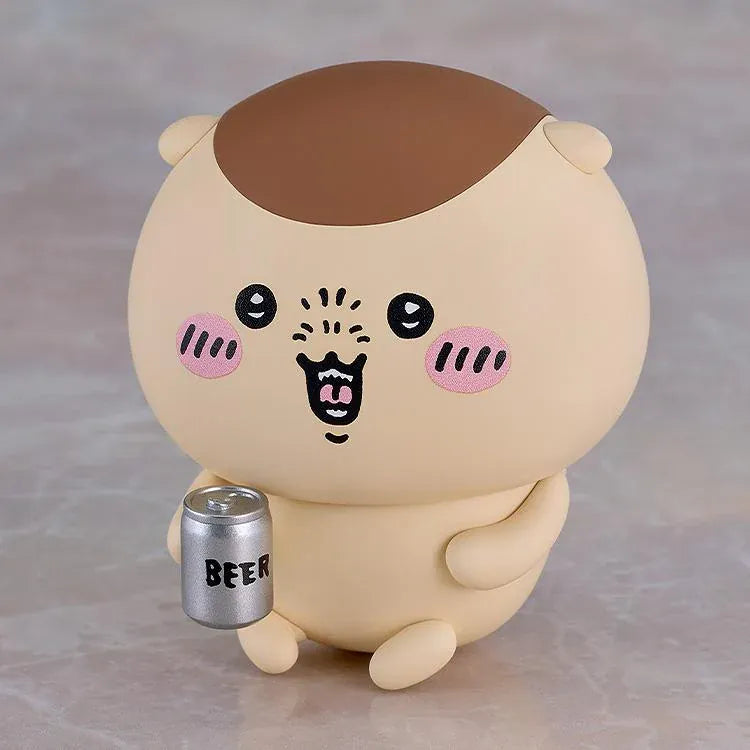 Chiikawa Nendoroid Kurimanju Figure featuring a round beige character with a chestnut-brown head, rosy pink cheeks, expressive black eyes, an open mouth, tiny arms, and small feet.
