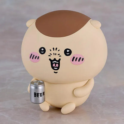 Chiikawa Nendoroid Kurimanju Figure featuring a round beige character with a chestnut-brown head, rosy pink cheeks, expressive black eyes, an open mouth, tiny arms, and small feet.