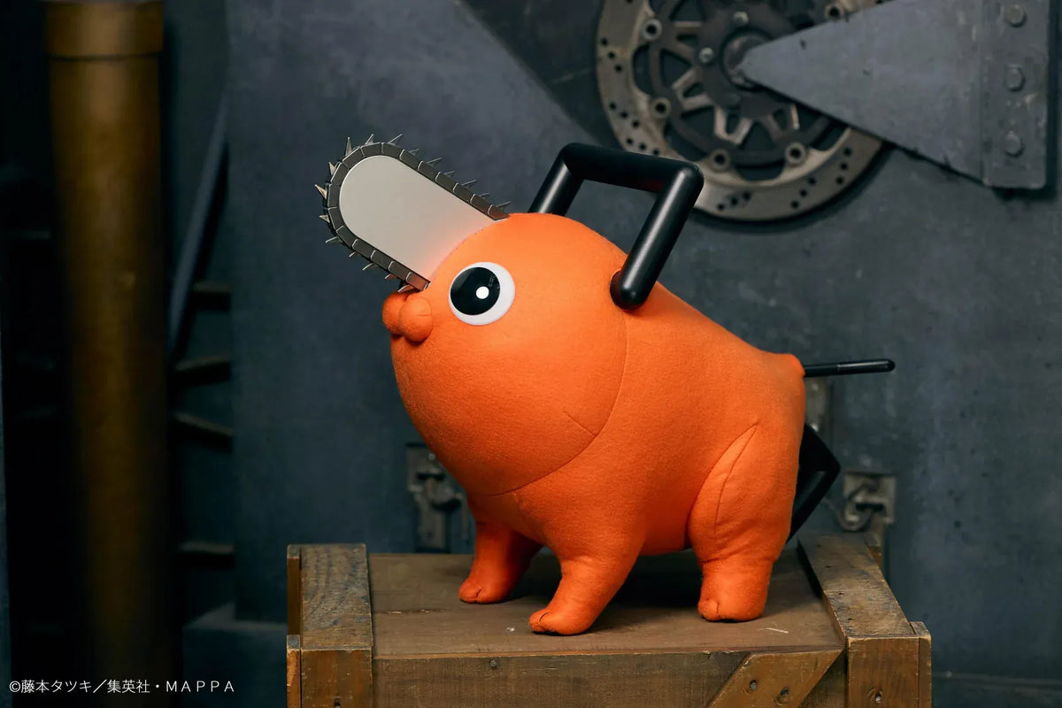 Chainsaw Man life-size Pochita doll figure with an orange body, glossy eyes, chainsaw blade, black handle, and pull cord.