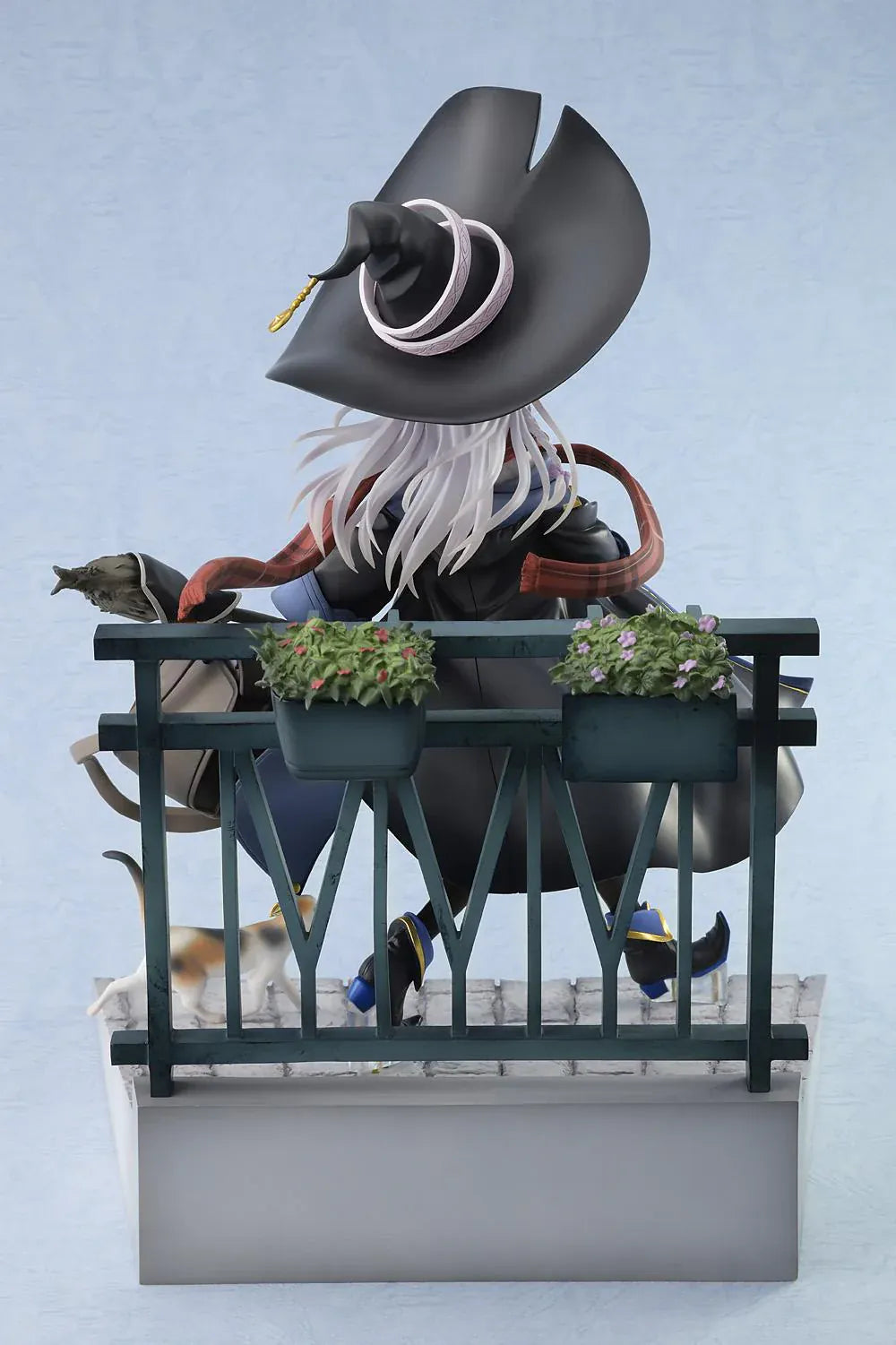 Wandering Witch The Journey of Elaina Elaina DX Ver. 1/7 Scale Figure Rerelease featuring Elaina seated on a bench with witch hat, broom, travel bag, cat, and stone-pavement display base.