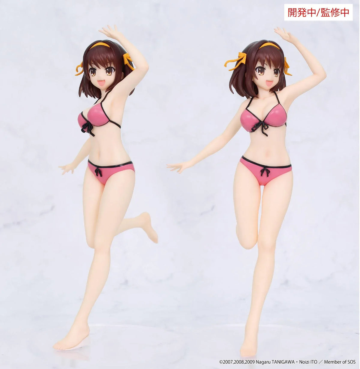 Vivit Haruhi Suzumiya figure wearing a pink swimsuit with black trim and yellow hair ribbons, smiling with one arm raised and one leg lifted.
