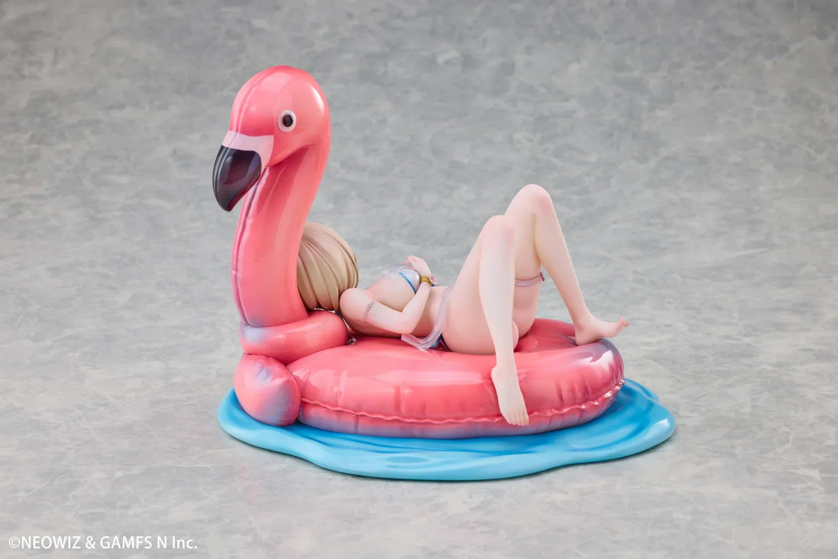 Brown Dust 2 Hot Summer Dream Justia 1/7 Scale Figure relaxing on a pink flamingo float with a water-themed display base