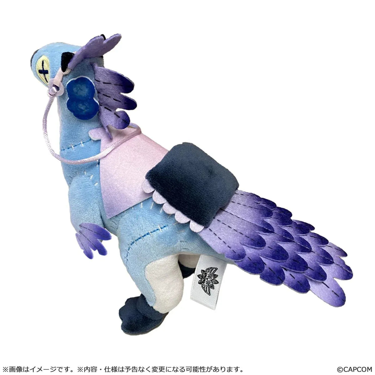 Monster Hunter Wilds Seikret Living Doll Caparison Plushie featuring a blue bird-like companion with purple feathers, button-style eyes, patchwork stitching, a decorative saddle, and dark blue feet.