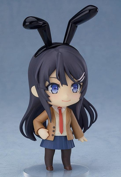 Rascal Does Not Dream of Bunny Girl Senpai Nendoroid Mai Sakurajima Figure (Rerelease) featuring a black-haired anime girl with blue eyes wearing a brown school blazer, red necktie, navy-blue pleated skirt, dark tights, and holding a black bunny ears accessory.
