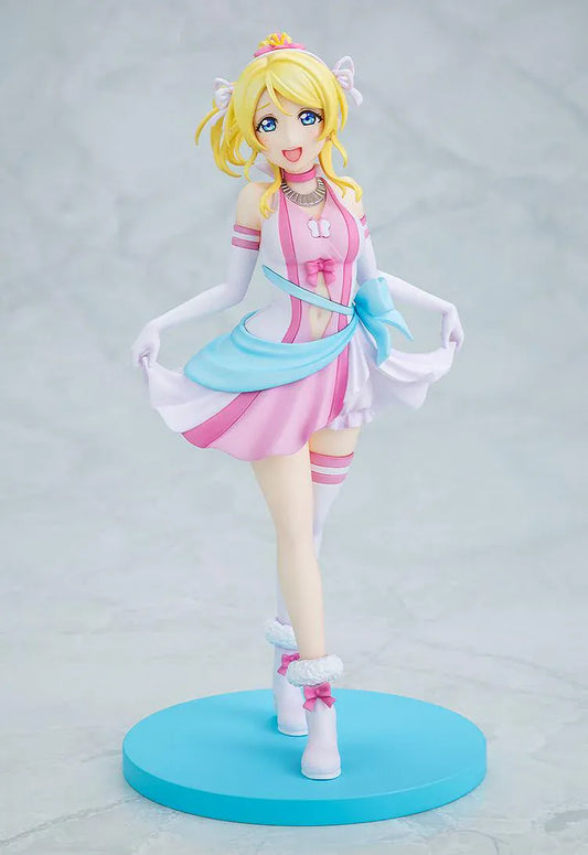 Love Live School Idol Project Eli Ayase Bokutachi wa Hitotsu no Hikari Ver. Figure with blonde hair, pink-and-white idol outfit, blue sash, and display base