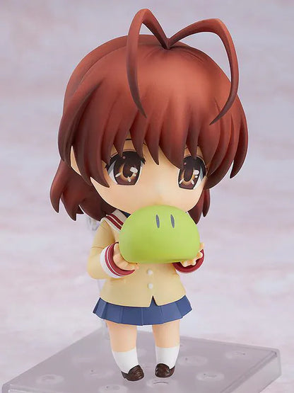 CLANNAD Nendoroid Nagisa Furukawa Figure featuring Nagisa in a chibi-style design with brown hair, cream cardigan, blue skirt, and school uniform details.