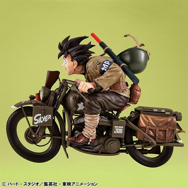 “Dragon Ball Z Desktop Real McCoy EX figure of Kid Goku riding a detailed military-style motorbike with gear and accessories.”