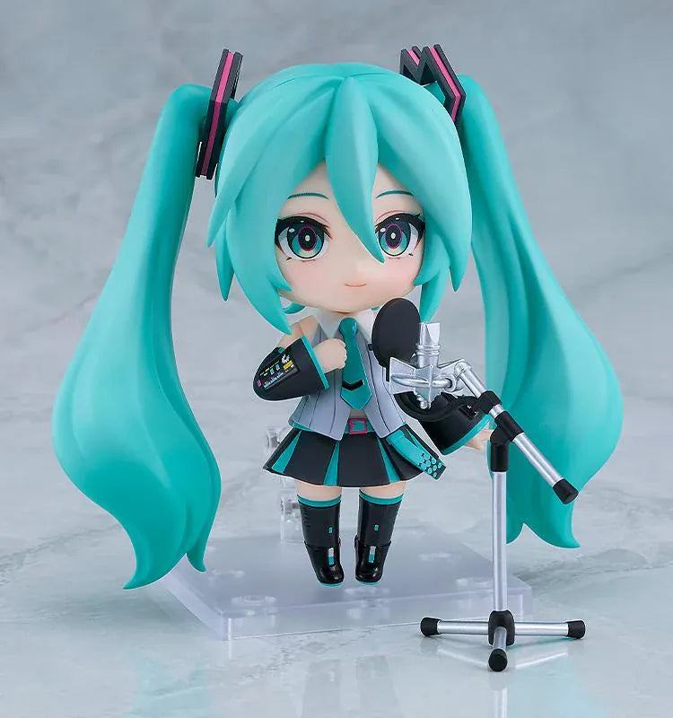 Hatsune Miku V6 Nendoroid figure with turquoise twin tails, an updated outfit, and interchangeable accessories.