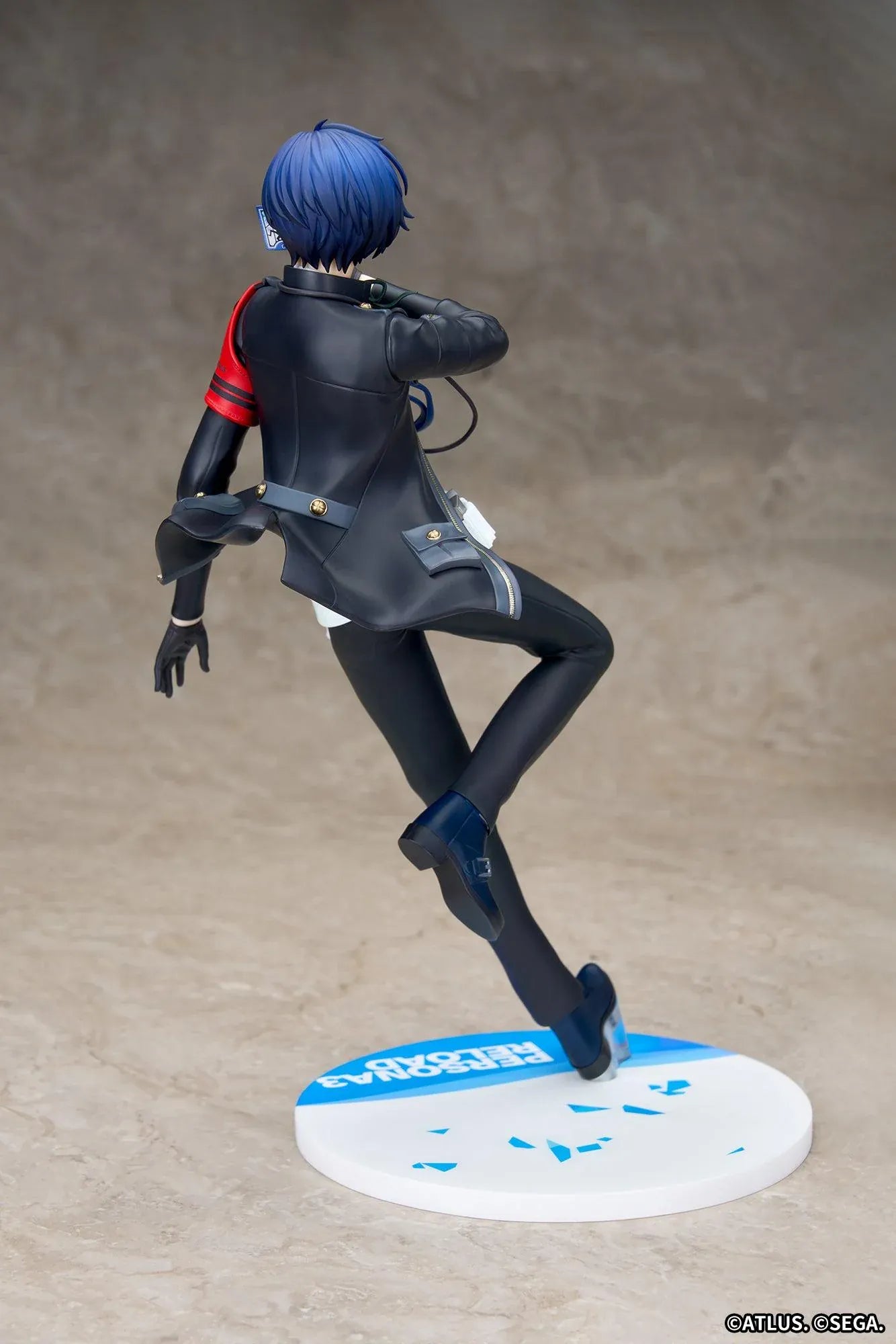 Persona 3 Reload Limepie Protagonist 1/8 Scale Figure with blue hair, black jacket, S.E.E.S. armband, headphones, and themed display base