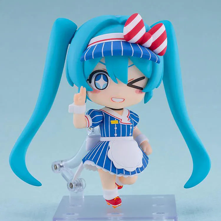 Hatsune Miku Nendoroid Hatsune Miku Mesmerizer Ver. Figure featuring Miku in a chibi-style design with teal twin tails, striped blue outfit, red and white bow, and apron-style details.
