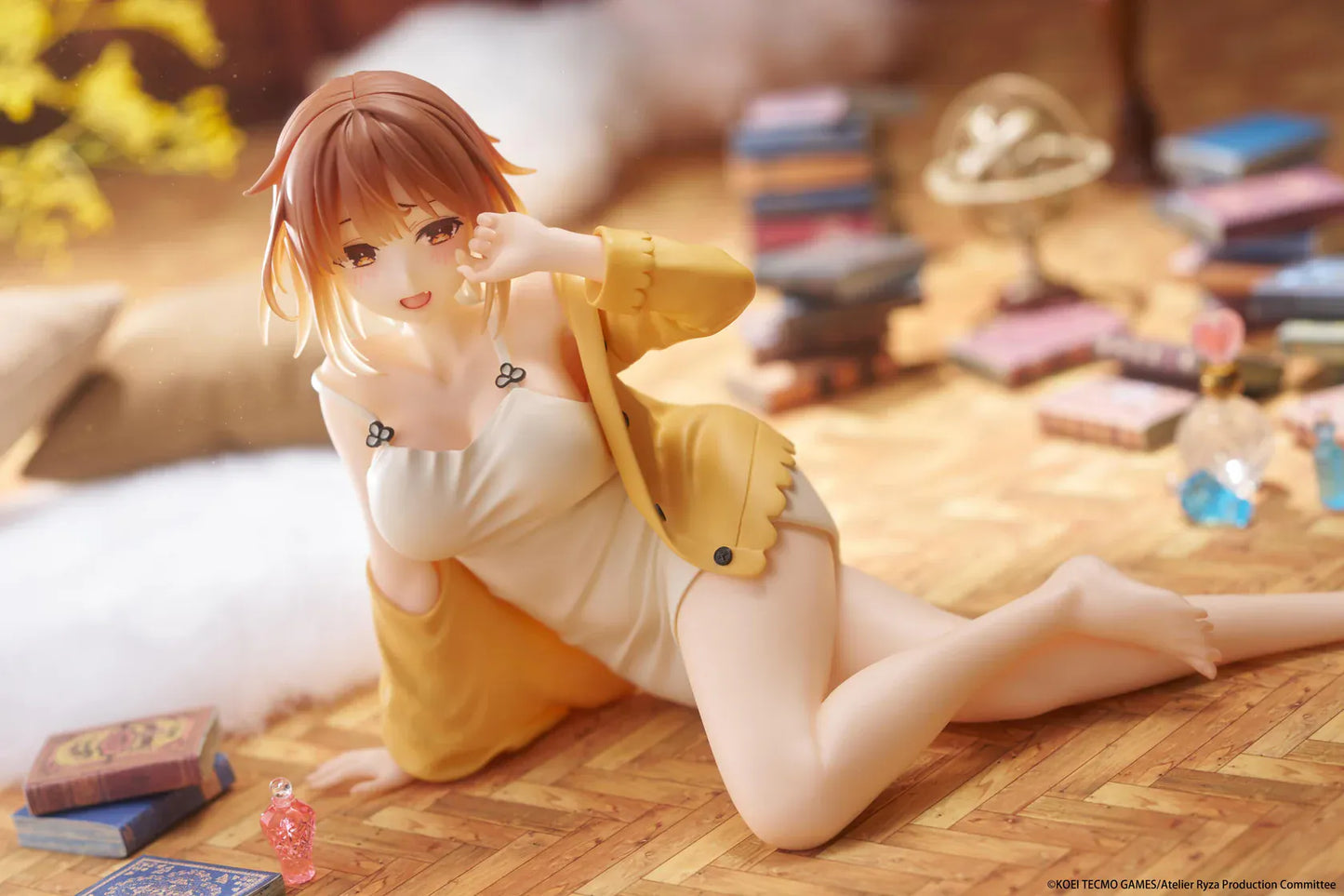 Atelier Ryza Desktop Cute Figure Ryza Nightwear Ver rerun featuring Ryza in a white nightwear outfit and yellow cardigan seated on a pink display background
