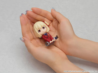 Lycoris Recoil Nendoroid Plus Chisato Nishikigi Rubber Mascot Figure with blonde hair, red uniform, and seated chibi pose