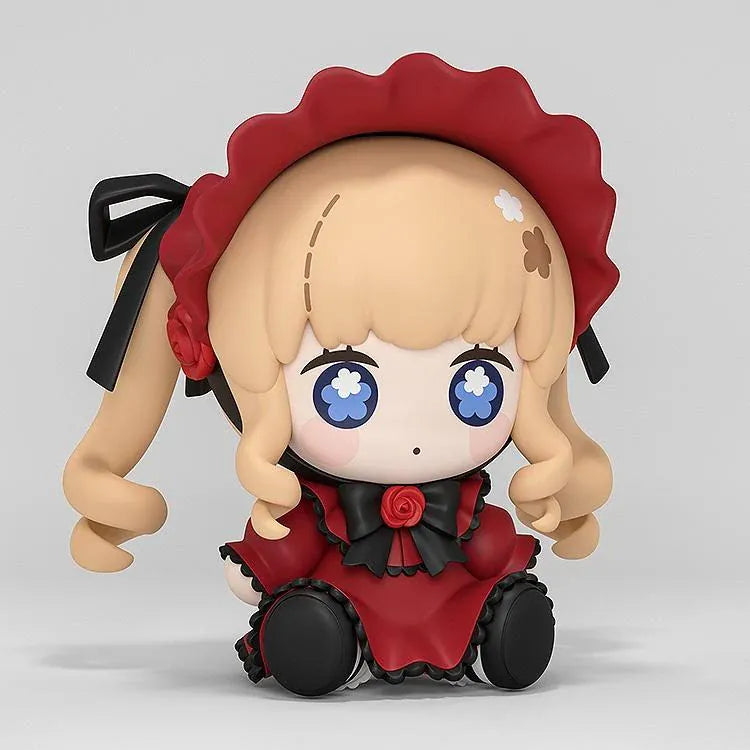 Rozen Maiden Huggy Good Smile Shinku Figure featuring a blonde-haired anime doll with blue eyes, long twin drill curls, a deep red gothic dress, black ribbons, rose decorations, and a matching red bonnet in a cute seated chibi design.
