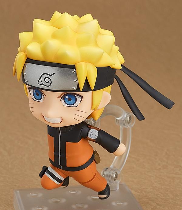 Chibi Nendoroid Naruto Uzumaki in orange jumpsuit performing the Shadow Clone Jutsu pose.