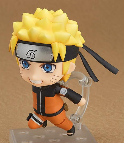 Chibi Nendoroid Naruto Uzumaki in orange jumpsuit performing the Shadow Clone Jutsu pose.