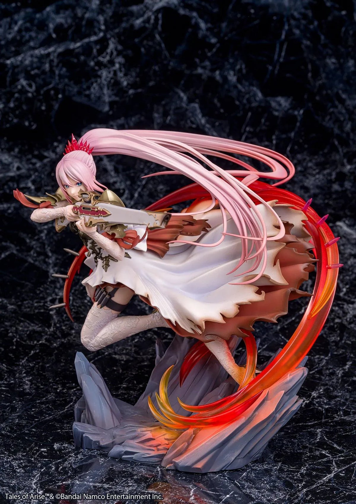 Tales of Arise Shionne 1/7 Scale Figure featuring a pink-haired anime character with blue eyes, an ornate white battle dress, gold armor, and lace stockings, aiming a detailed rifle while suspended in a dynamic pose surrounded by translucent red and orange effects on a rocky display base.